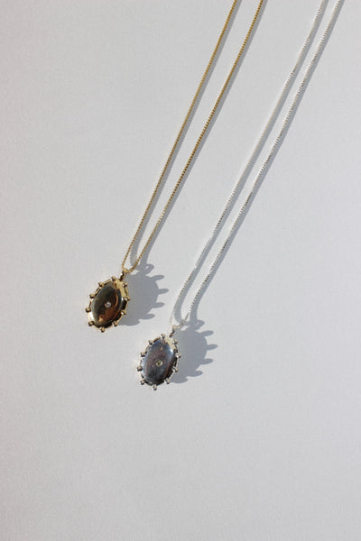 The Sun Locket in Brass + White Sapphire