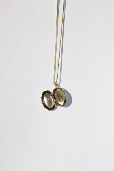 The Sun Locket in Brass + White Sapphire