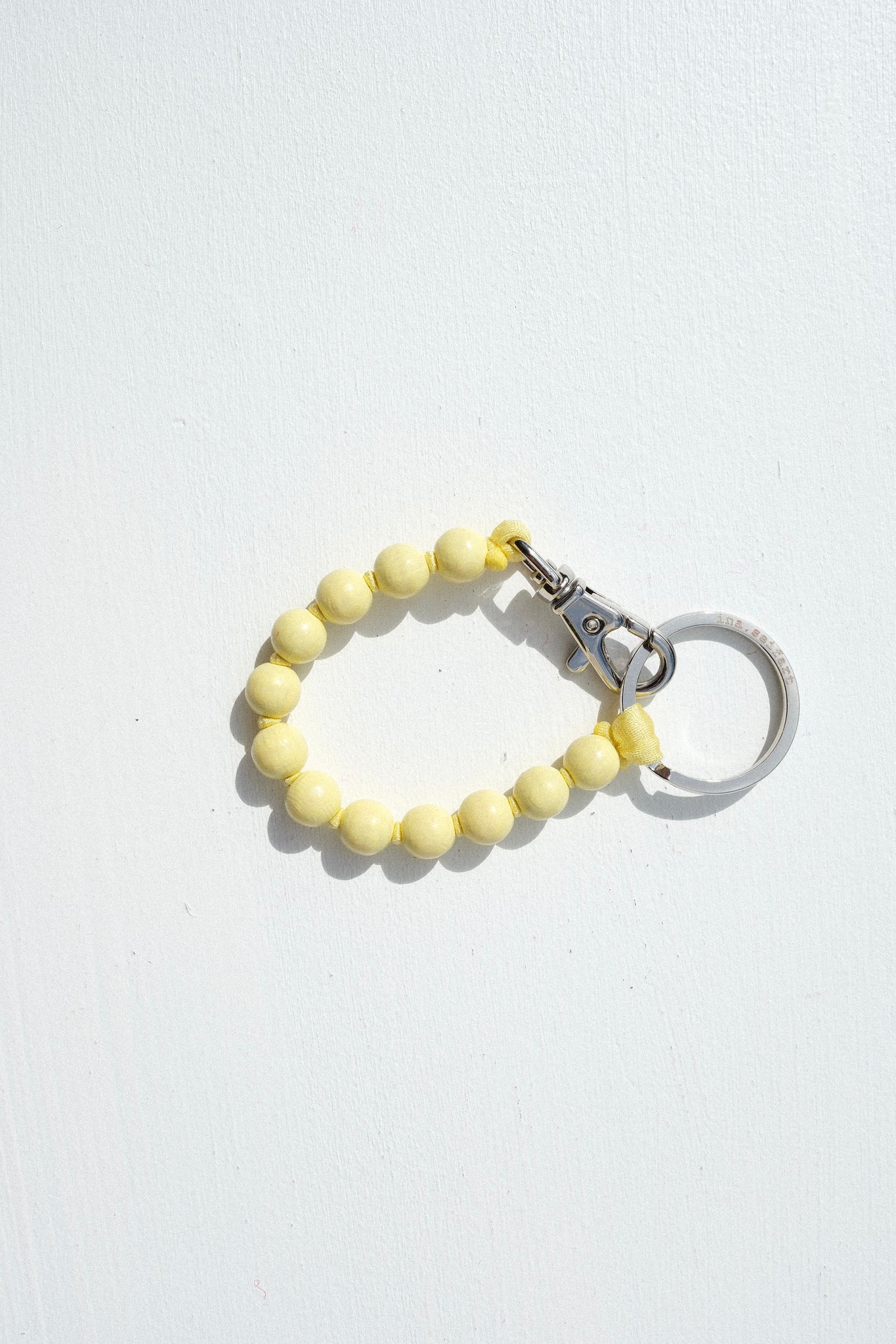 Short Perlen Keychain in Pastel Yellow